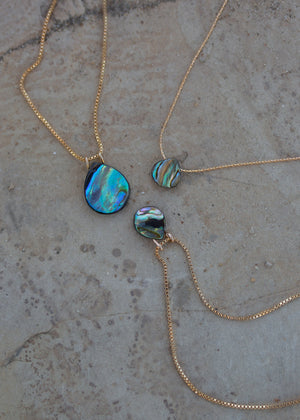Three iridescent blue/green abalone necklaces with 14k gold chains.