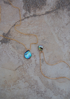 Two examples of the venetian box chain variants, one with a bigger teardrop abalone pendant and one with a smaller teardrop abalone pendant.