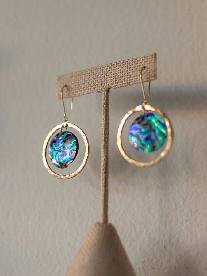 Pair of gold hoop earrings with abalone shell centers 