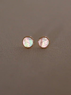 Pair of round gold earring studs with iridescent mother of pearl